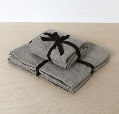 folded stack of 100% linen powder room towel set hand towels wash cloths heavyweight Orkney linen fabric antimicrobial fast drying natural light brown beige tan color